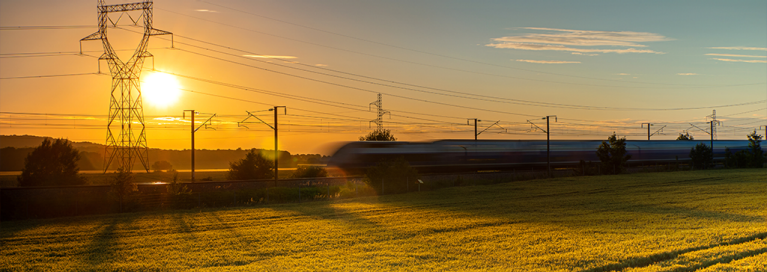 masthead-france-sunset-view-train-through-field