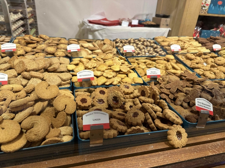 Hundreds of butter cookies in different shapes at a Christmas market stand