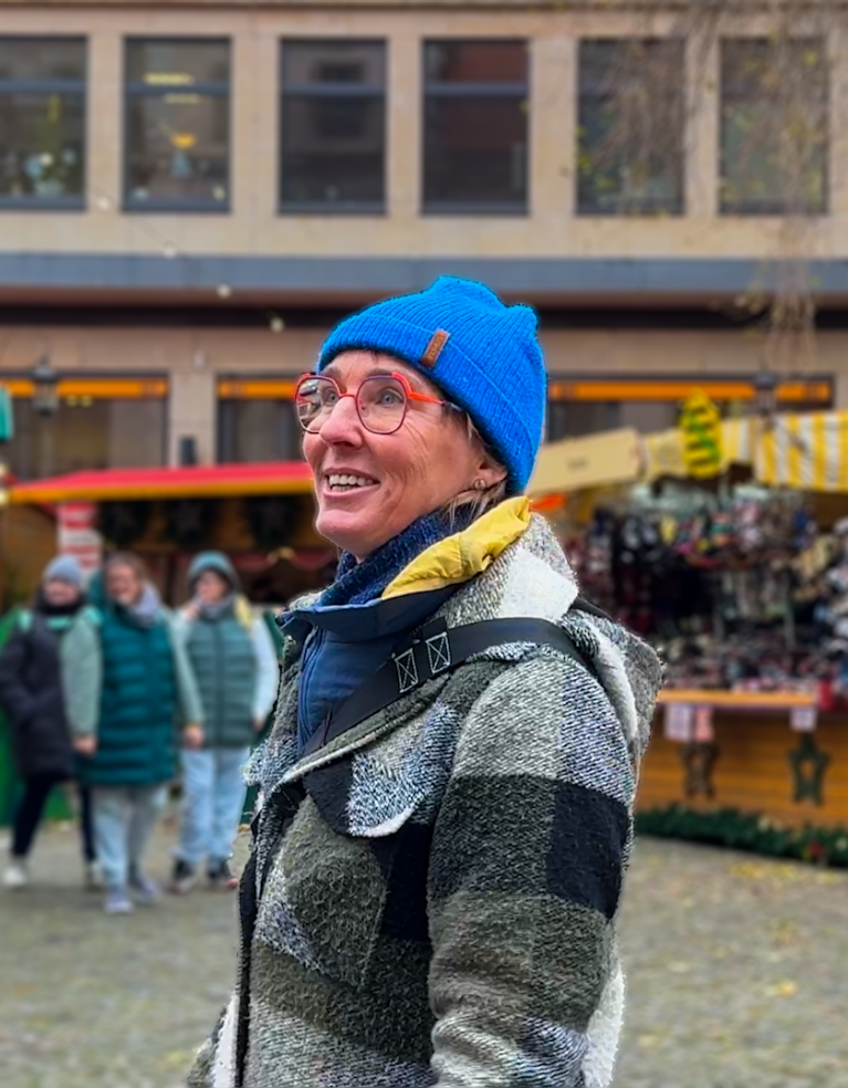 Anett walking outside at a Christmas market in Dresden