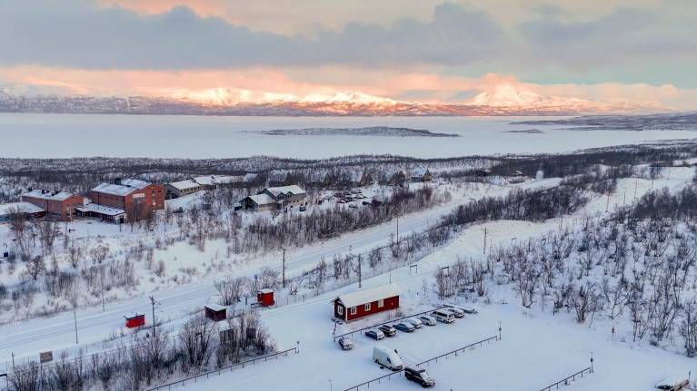 An aerial view of Abisko and the nearby lake