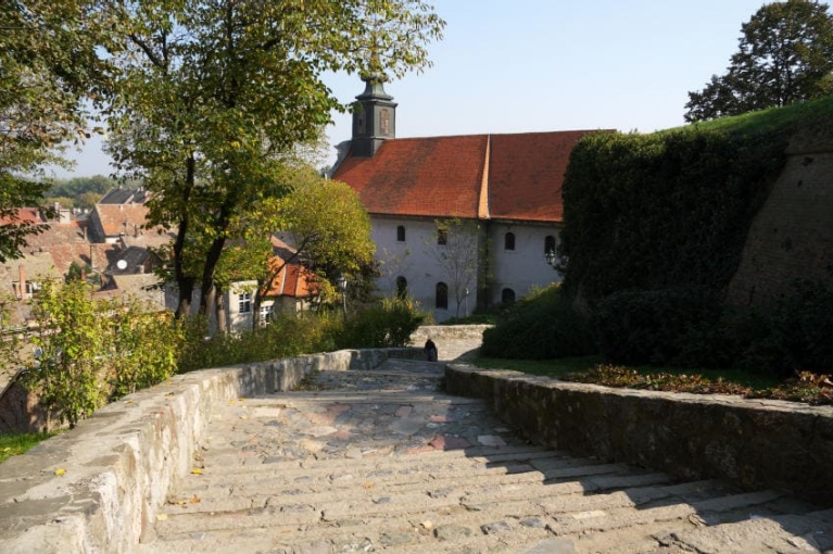 A set of outdoor stairs and historic building at Petrovaradin Fortress in Novi Sad