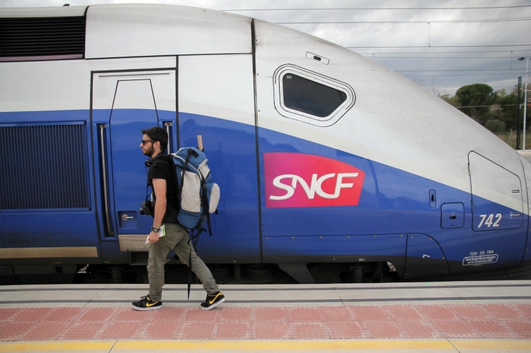 backpacking walking to tgv train in Figueres