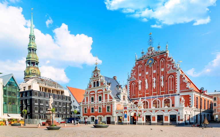 A square with historic buildings in Riga