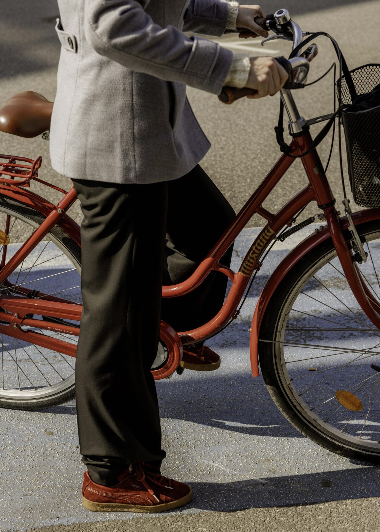 A woman sitting on a bike in Copenhagen, Denmark